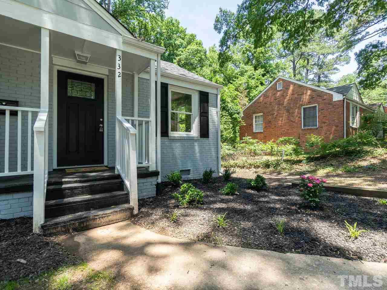 332 Angier Avenue Raleigh, NC 27610 - Photo 3 of 30 a backyard of a house with flower plants and trees