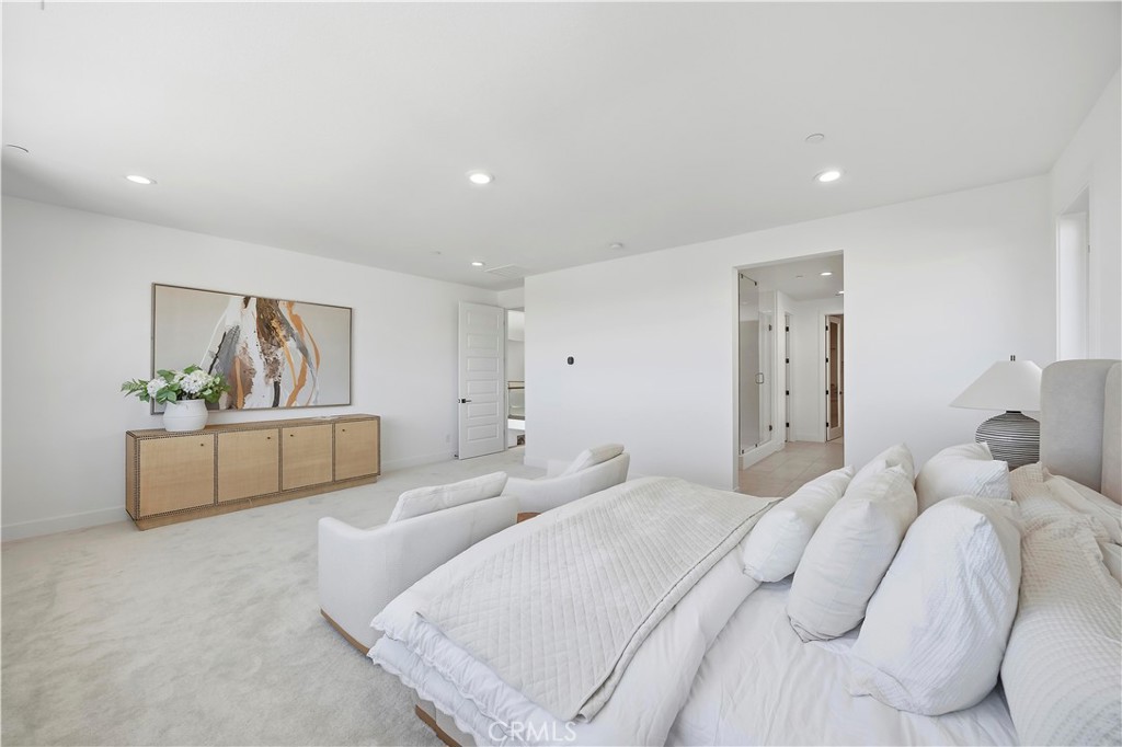 20138 Marlow Lane Porter Ranch, CA 91326 - Photo 22 of 39 a bedroom with a bed a couch and painting on the wall