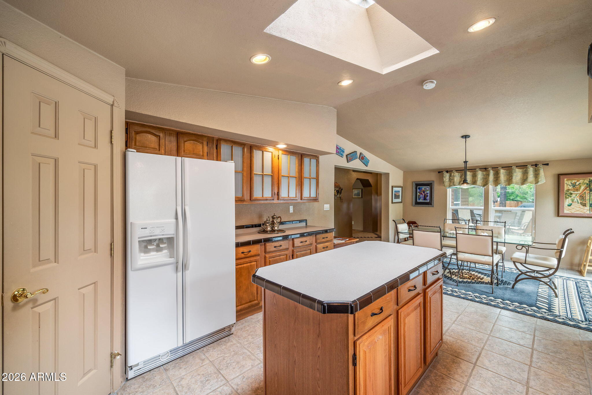 758 Southlake Road Lakeside, AZ 85929 - Photo 64 of 95 an open kitchen with a table and chairs in it
