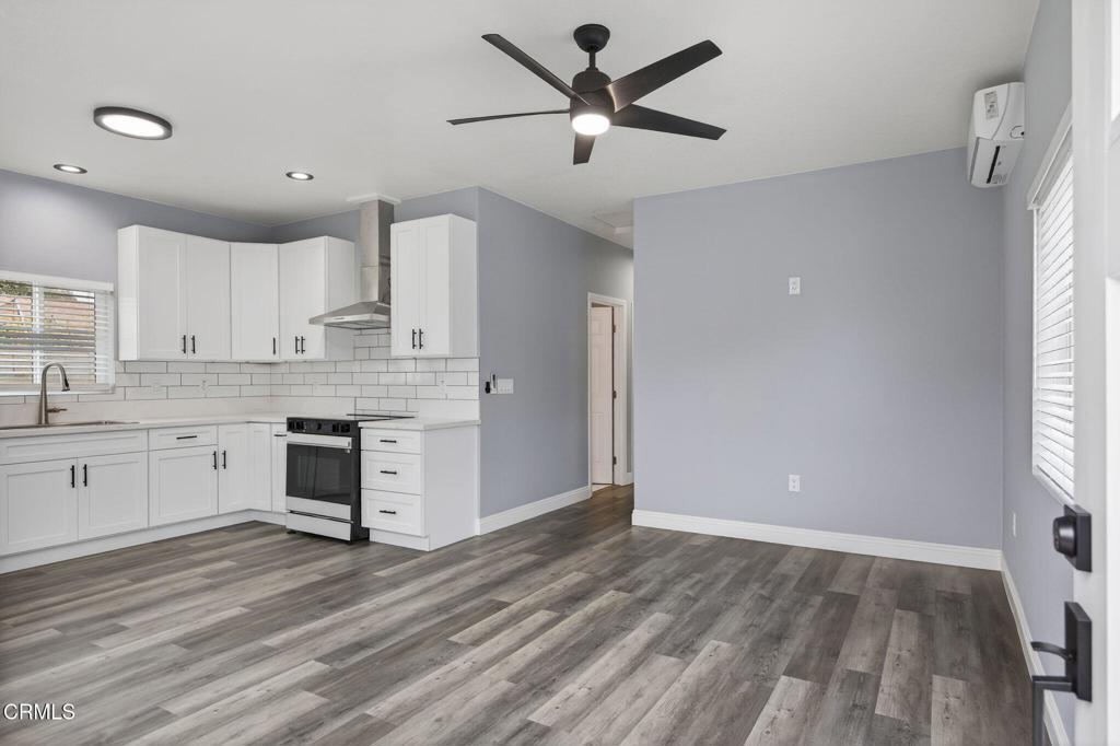 1341-2 Juneberry Place Oxnard, CA 93036 - Photo 1 of 1 a kitchen with a refrigerator window and a sink
