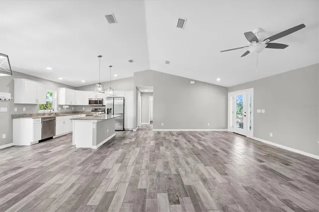 a view of kitchen with wooden floor and window