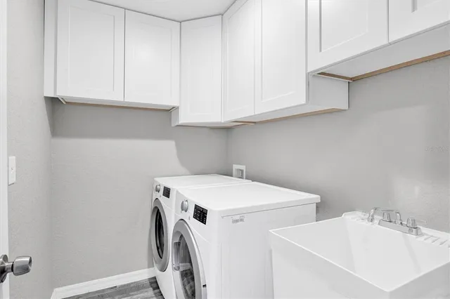 a utility room with dryer and washer