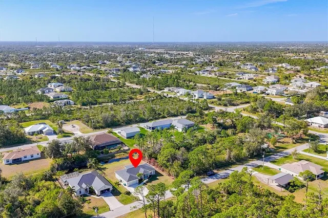 an aerial view of residential houses with outdoor space