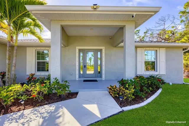 a view of a front door and a garden