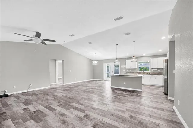 a view of kitchen and kitchen with a sink