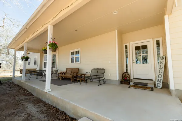 a view of swimming pool with outdoor seating