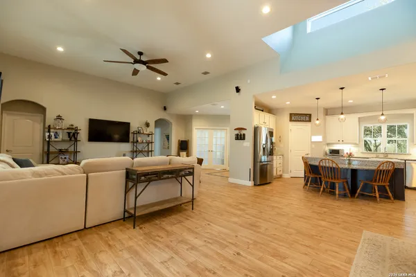 a living room with furniture wooden floor and a rug