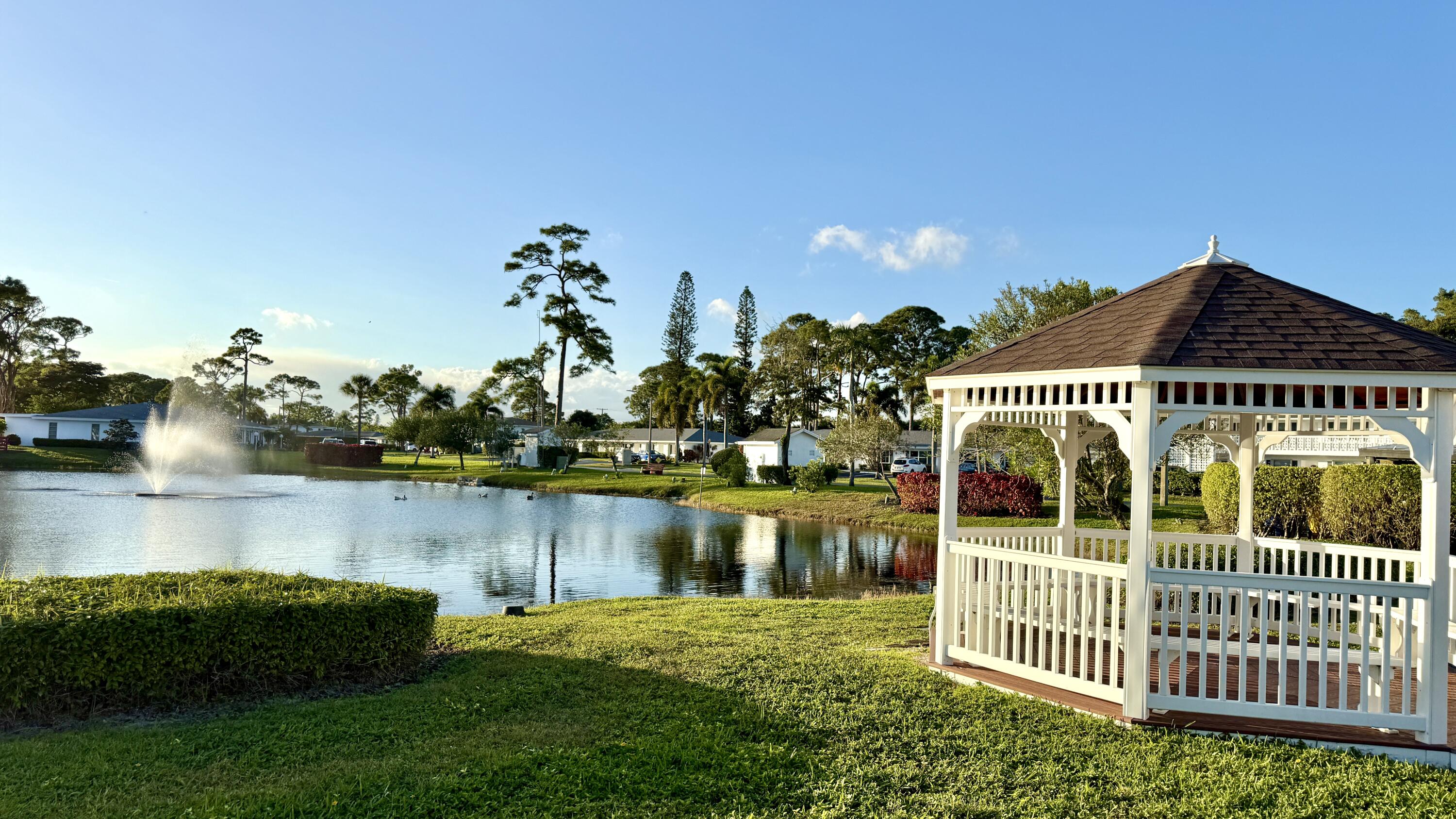 5242 Privet Place Delray Beach, FL 33484 - Photo 50 of 50 a front view of a house with a garden