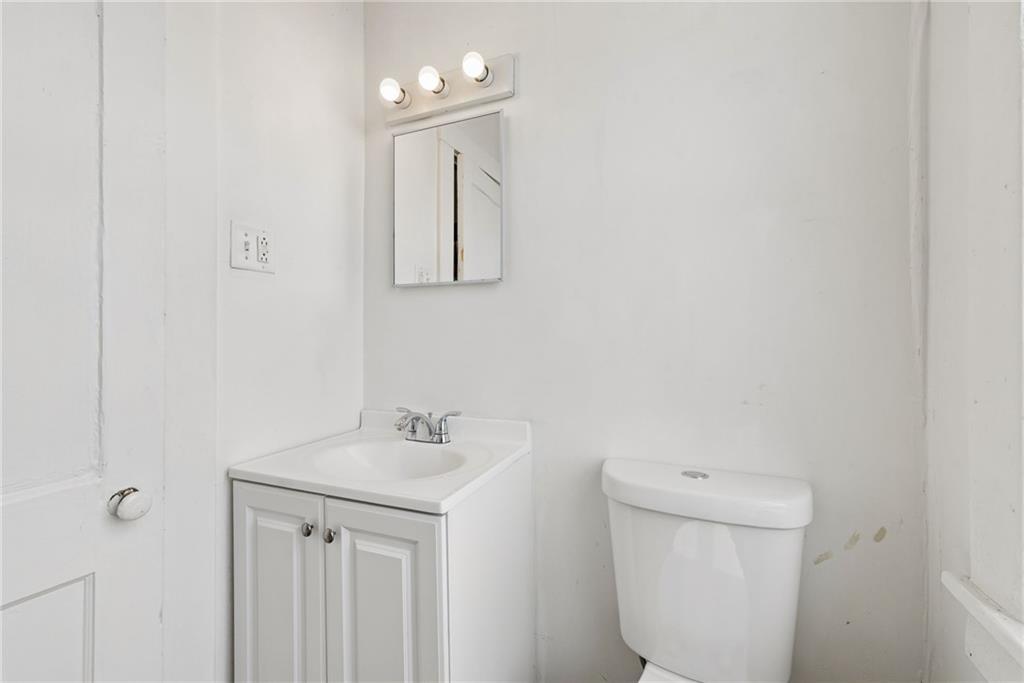 206 North Warren Avenue Apollo, PA 15613 - Photo 9 of 23 a bathroom with a toilet sink and mirror