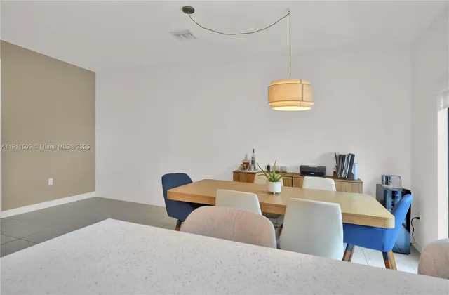 a living room with couches and painted walls