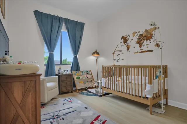 a bedroom with furniture and a window