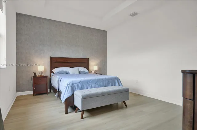 a bedroom with a bed and a table