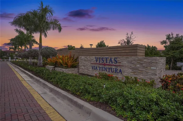 a view of a street with a building in the background