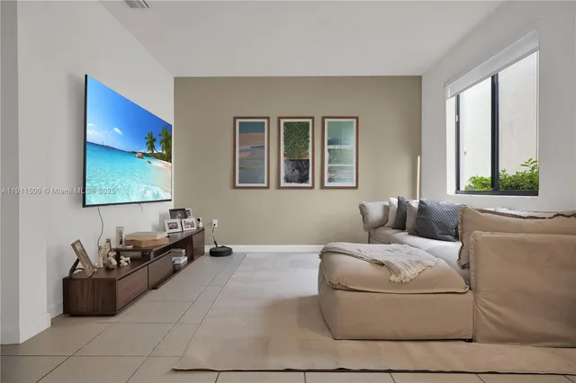 a living room with furniture and window