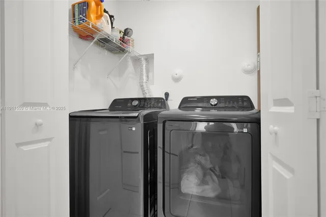 a utility room with dryer and washer