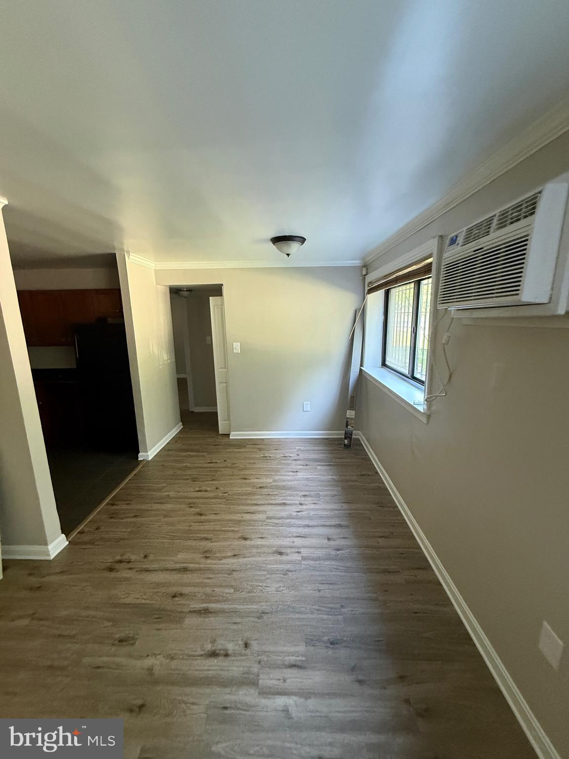3105 Naylor Road Southeast, Unit 104 Washington, DC 20020 - Photo 9 of 12 a view of empty room with wooden floor