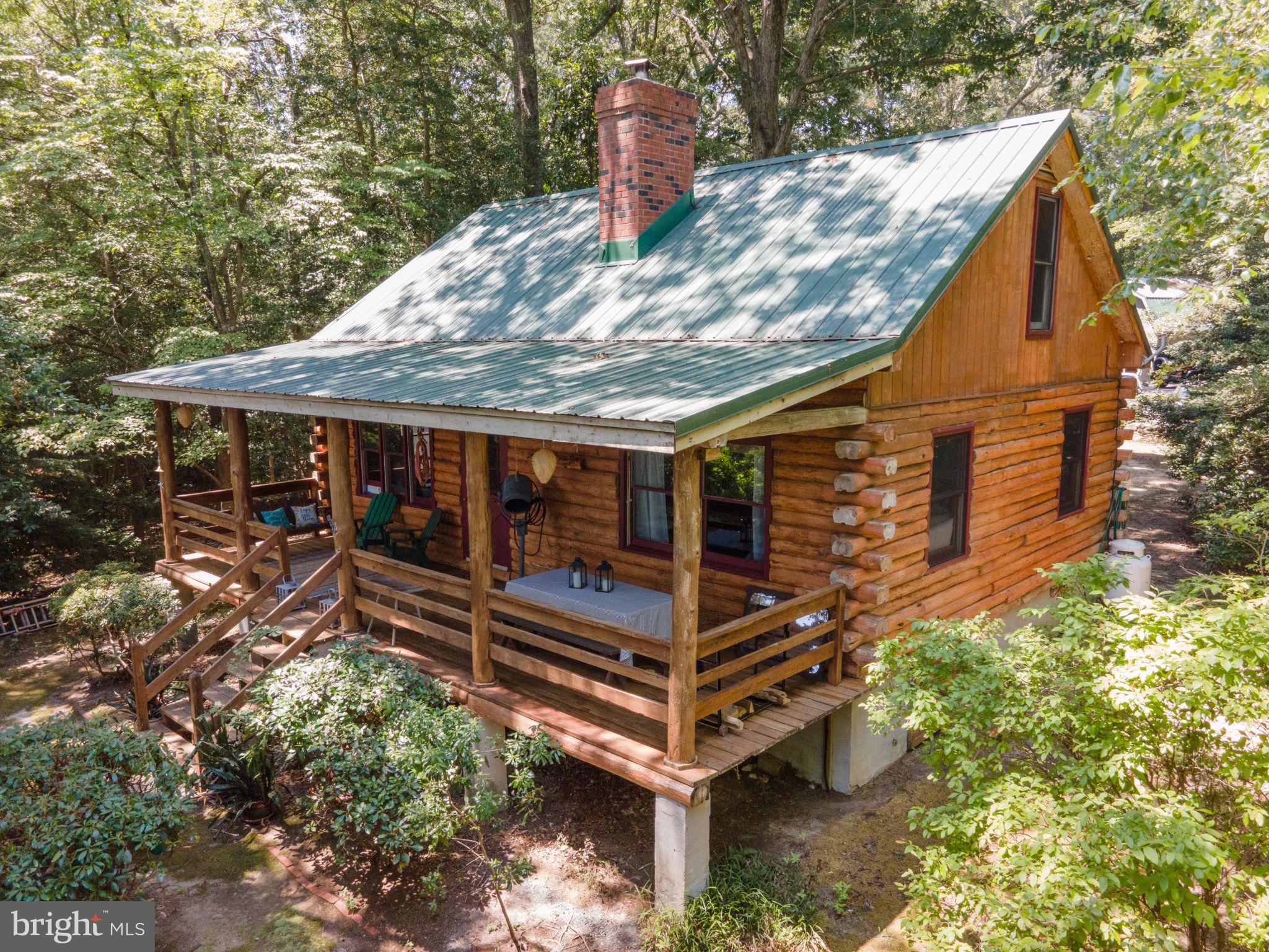 1067 Level Green Road Lancaster, VA 22503 - Photo 1 of 80 Quintessential Waterfront Log Cabin