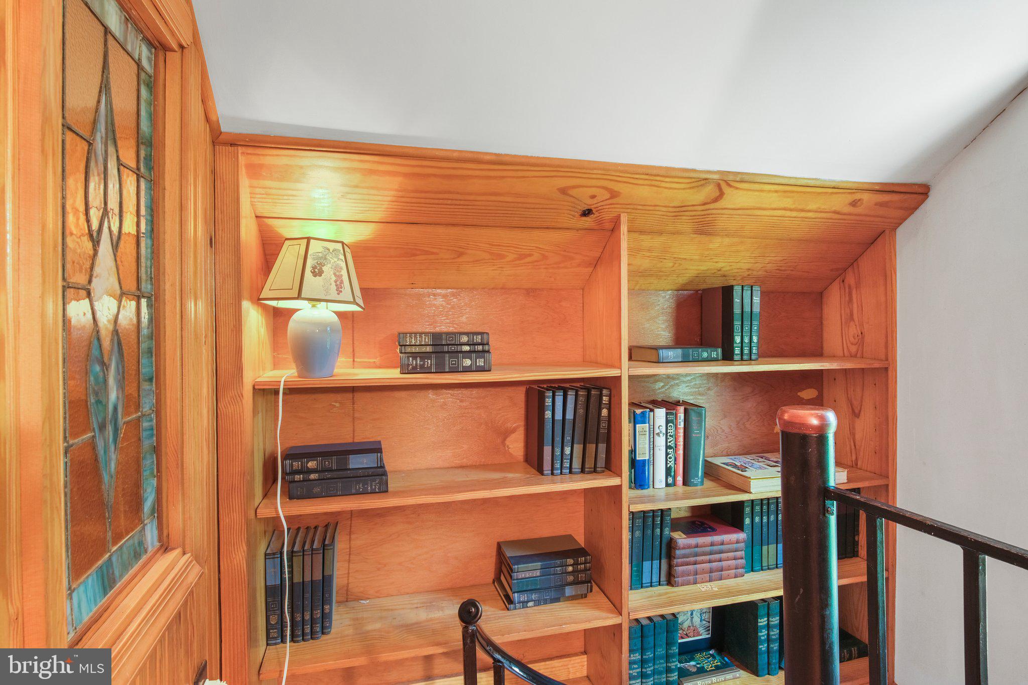 1067 Level Green Road Lancaster, VA 22503 - Photo 39 of 80 Stairside Built-in Bookshelves