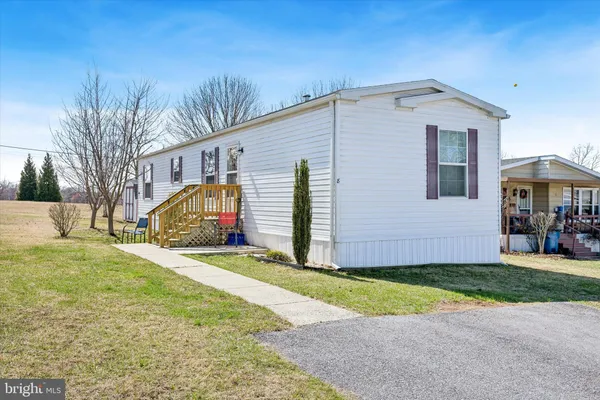 a view of a yard in front of a house with a yard