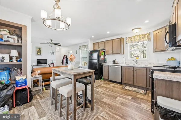 a kitchen that has a table and chairs in it
