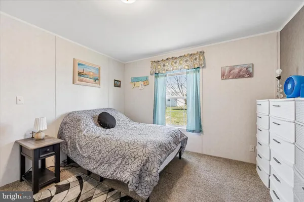 a bedroom with a bed and a table in it