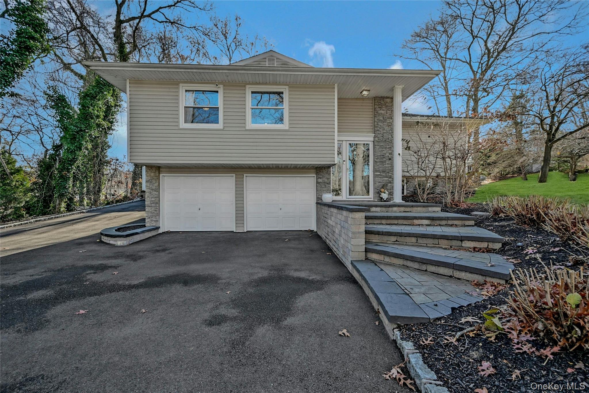 a front view of a house with a garage