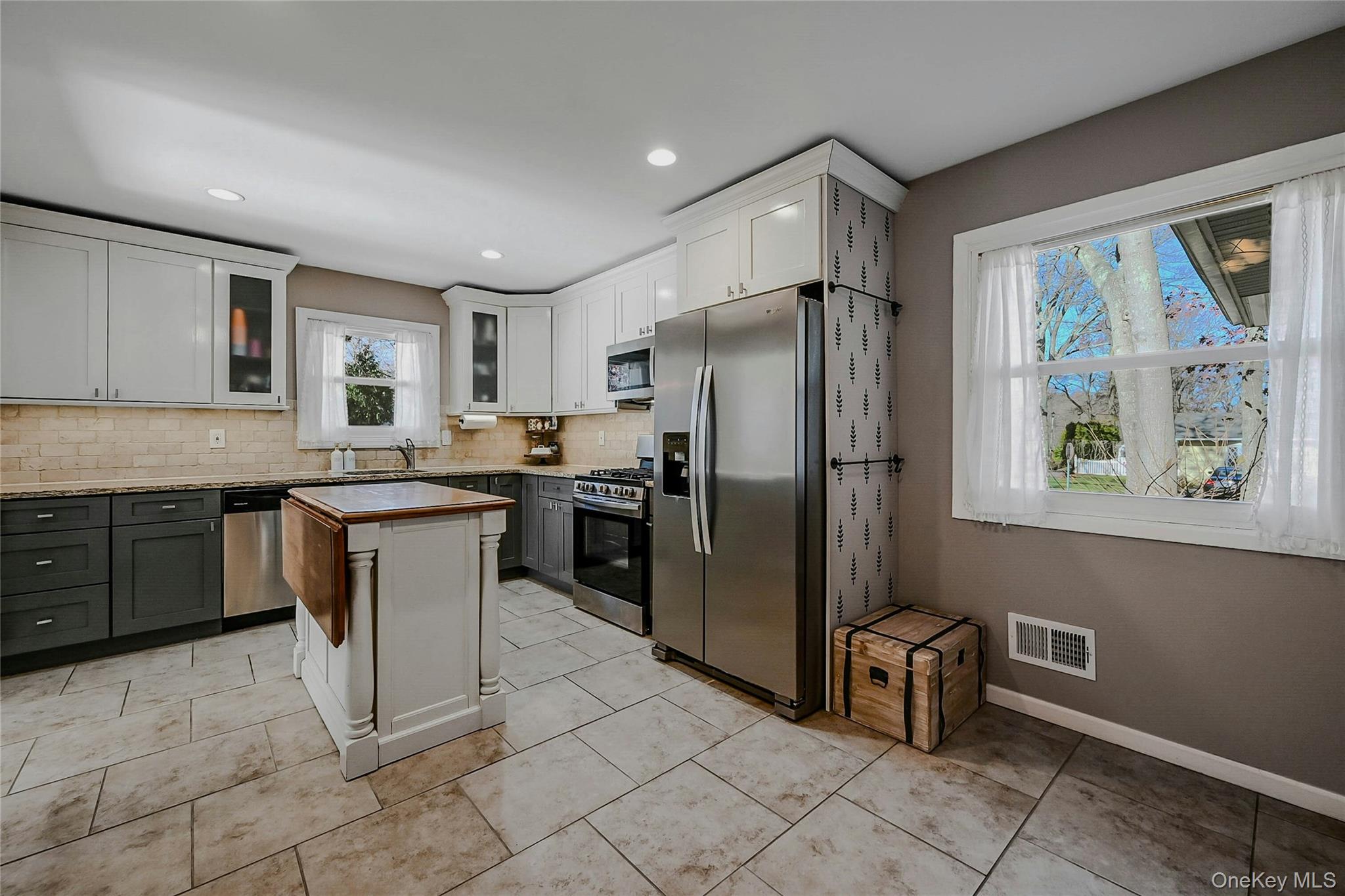 4 Park Road Rocky Point, NY 11778 - Photo 13 of 38 a kitchen with granite countertop a refrigerator stove top oven and sink