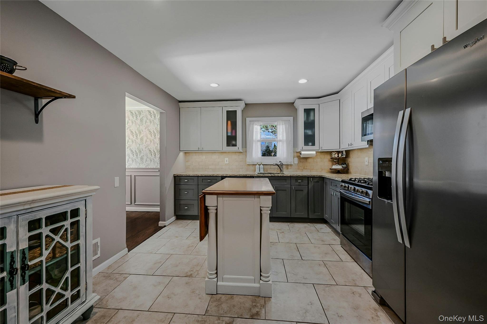 4 Park Road Rocky Point, NY 11778 - Photo 14 of 38 a kitchen with a sink cabinets and stainless steel appliances