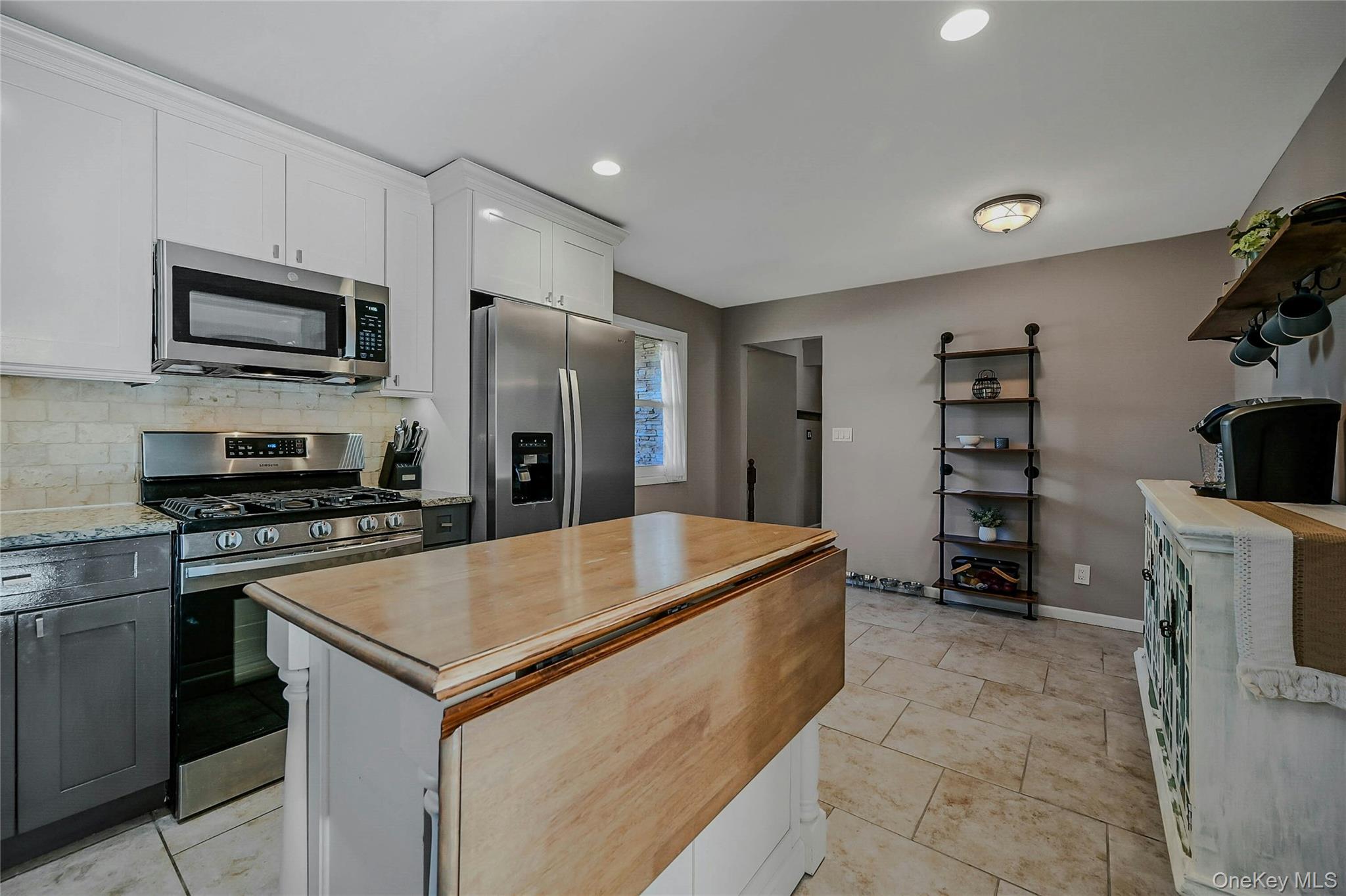 4 Park Road Rocky Point, NY 11778 - Photo 16 of 38 a kitchen with stainless steel appliances granite countertop a refrigerator oven a sink and dishwasher