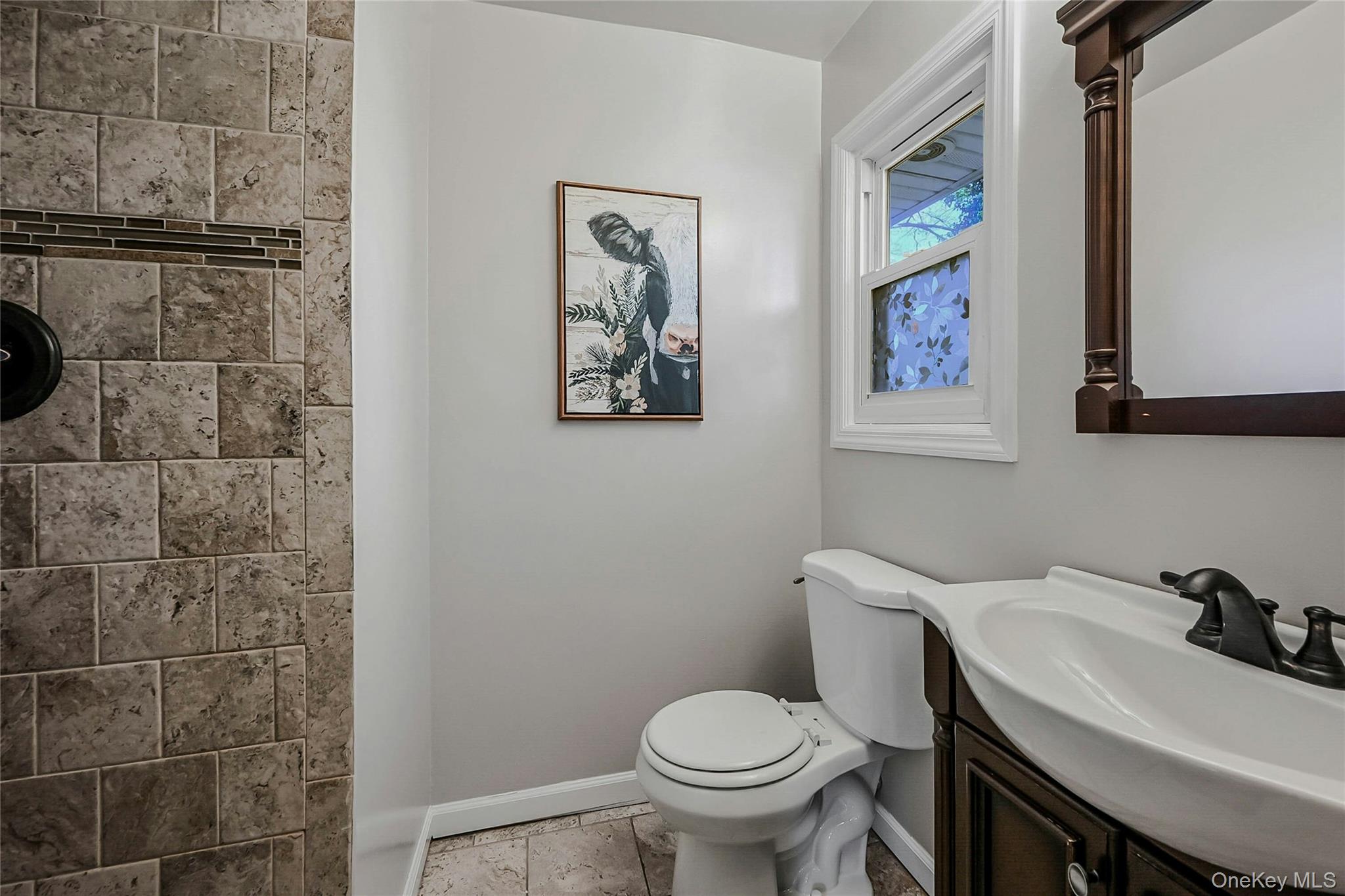 4 Park Road Rocky Point, NY 11778 - Photo 22 of 38 a bathroom with a sink and a toilet