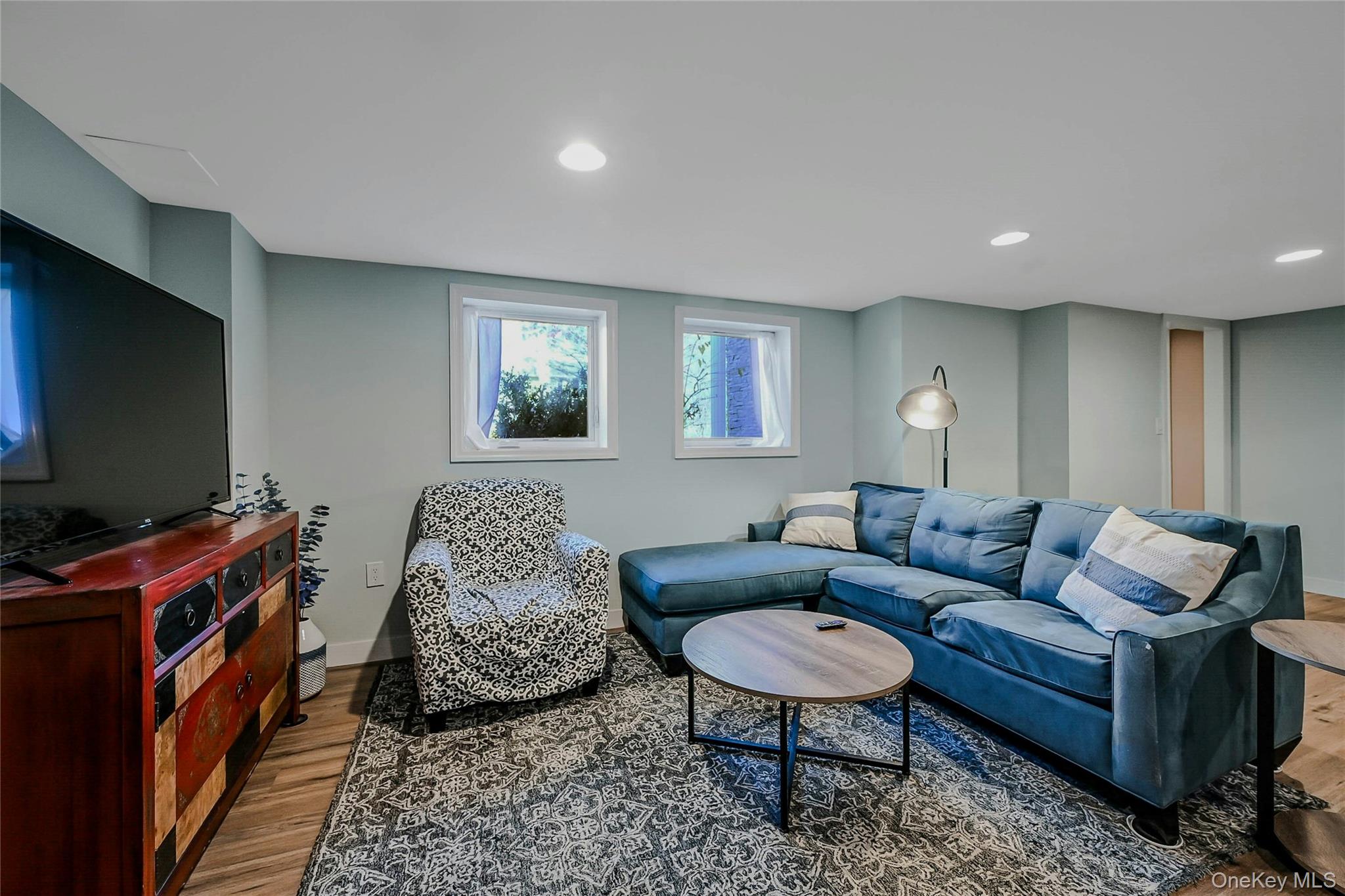 4 Park Road Rocky Point, NY 11778 - Photo 27 of 38 a living room with furniture and a flat screen tv