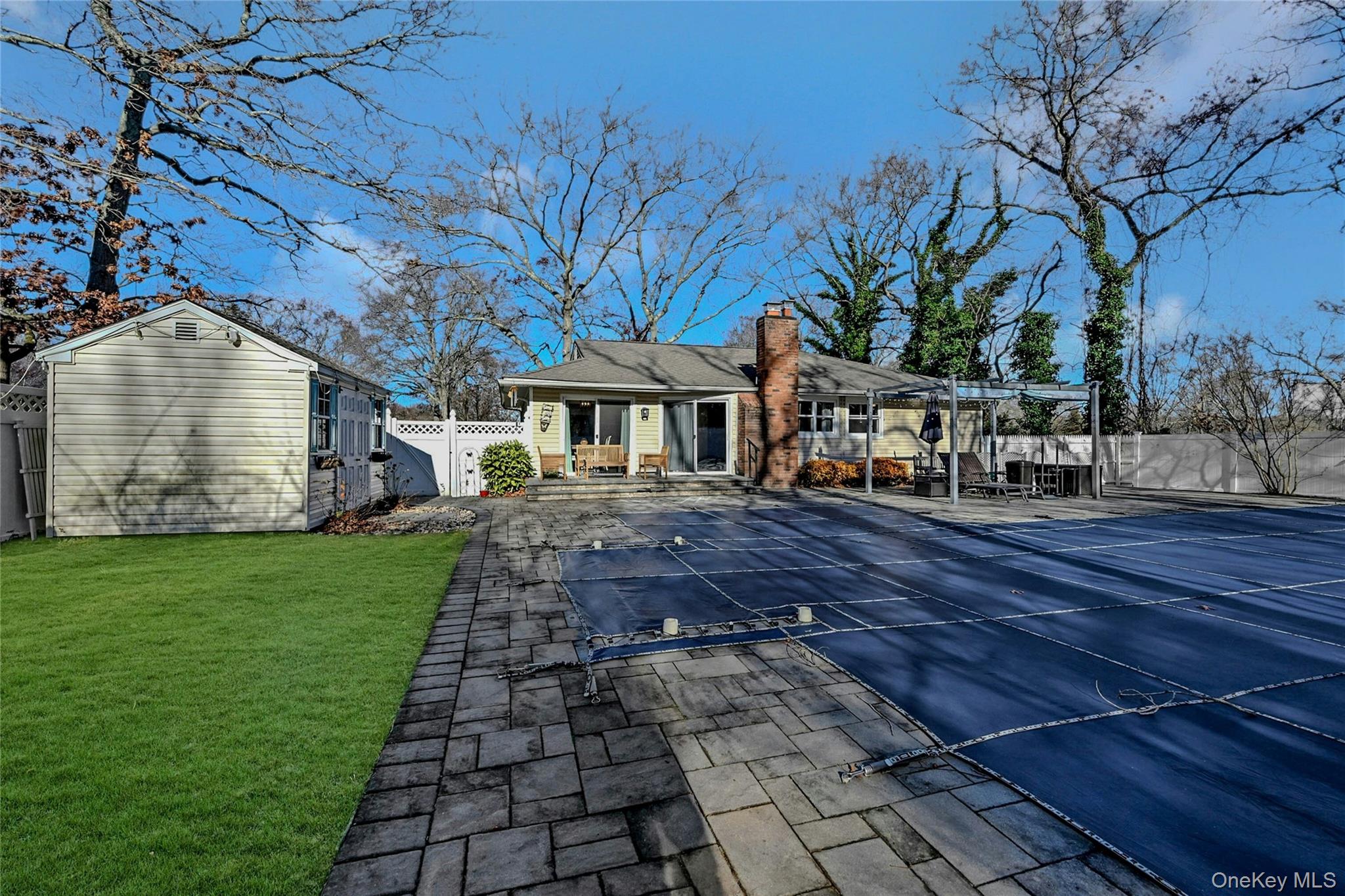 4 Park Road Rocky Point, NY 11778 - Photo 31 of 38 a front view of a house with a garden