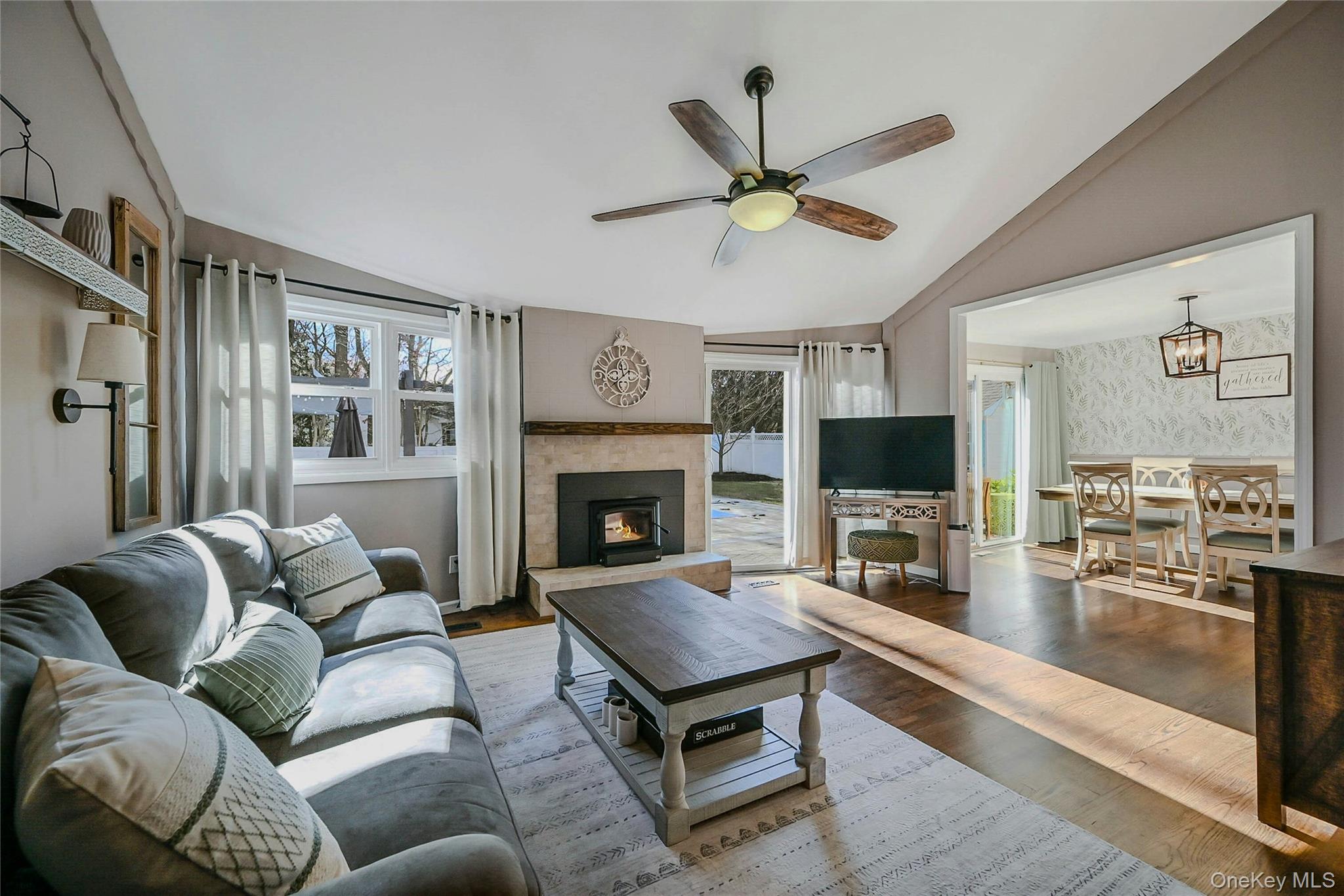 4 Park Road Rocky Point, NY 11778 - Photo 9 of 38 a living room with furniture a flat screen tv and a fireplace