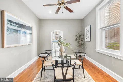 a view of a dining room with furniture window and wooden floor