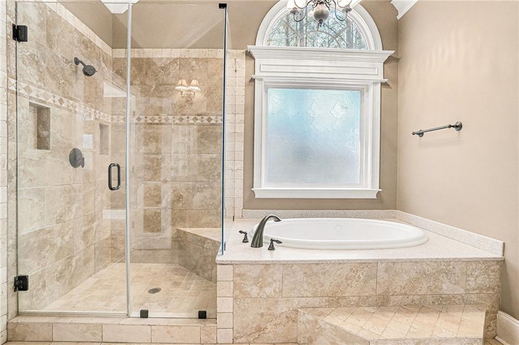 390 Glengarry Chase Covington, GA 30014 - Photo 13 of 21 a bathroom with a granite countertop shower mirror and a sink