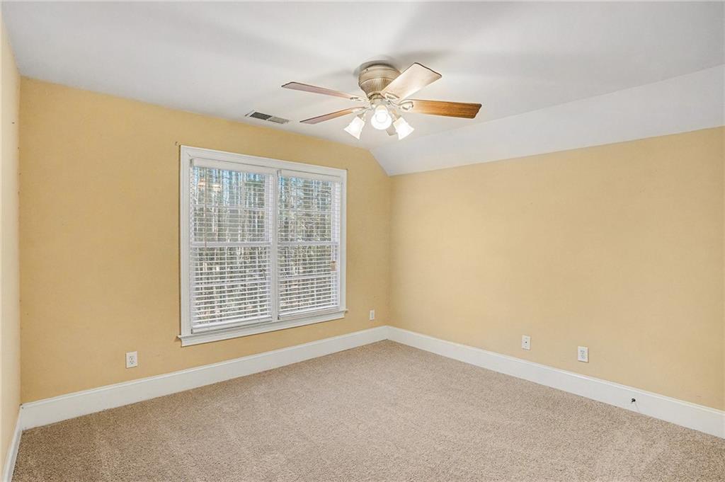390 Glengarry Chase Covington, GA 30014 - Photo 18 of 21 a view of an empty room with a window
