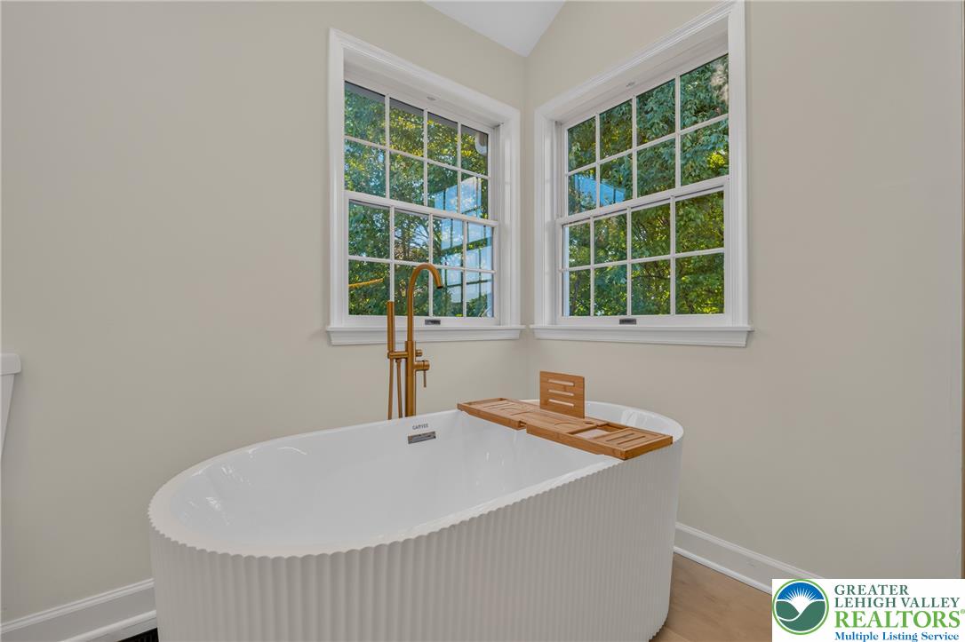 3130 Muirfield Road Center Valley, PA 18034 - Photo 33 of 63 Large windows bathe the freestanding soaking tub area in natural light.
