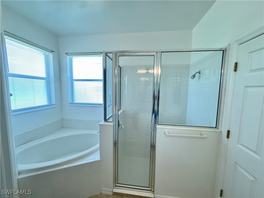 12635 Stone Tower Loop Fort Myers, FL 33913 - Photo 16 of 27 a bathroom with a bathtub shower and a sink
