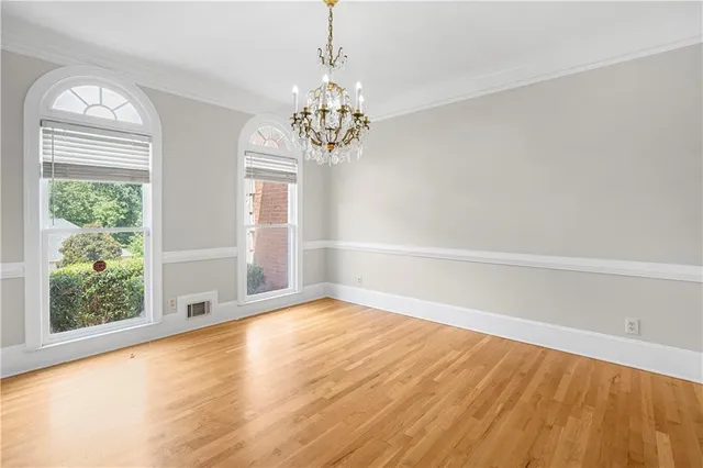 a view of kitchen with furniture and wooden floor