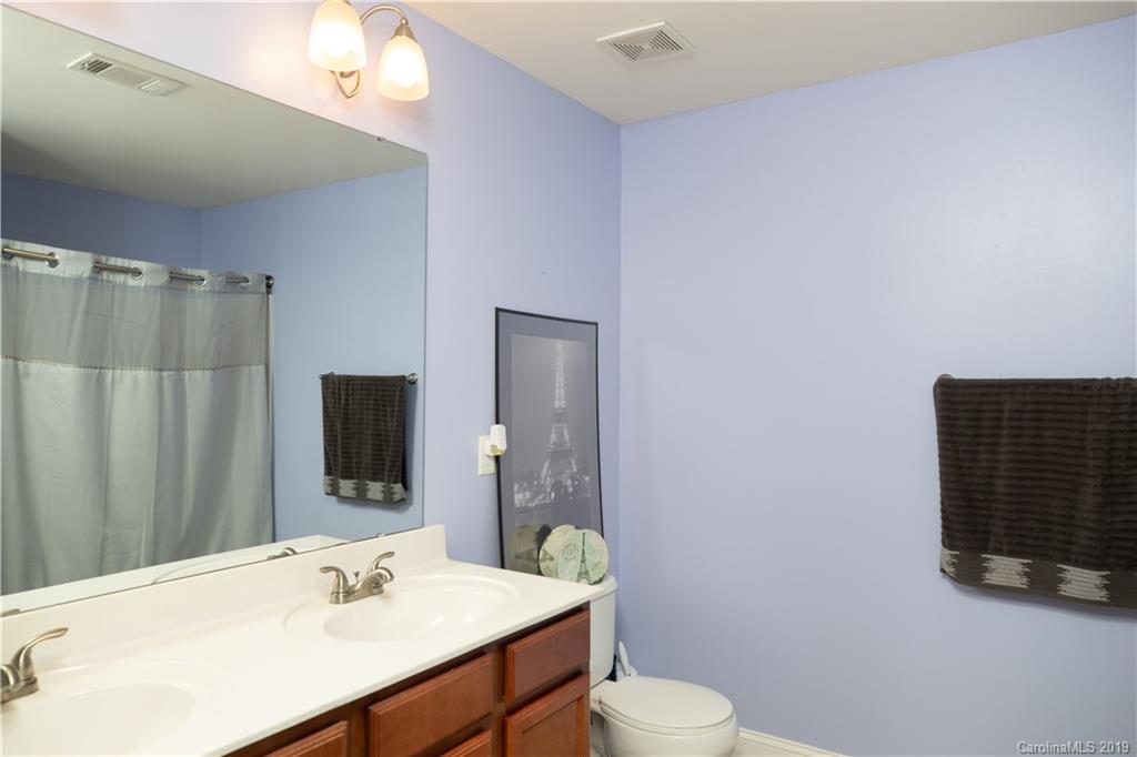 254 River Clay Road, Unit 207 Fort Mill, SC 29708 - Photo 14 of 23 a bathroom with a sink vanity mirror and toilet
