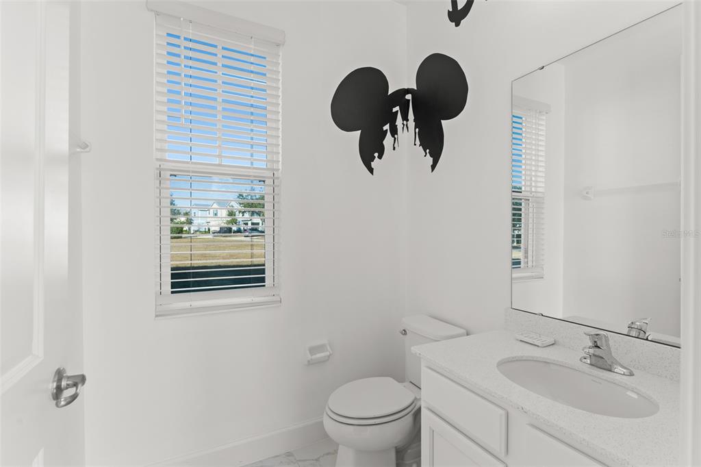 1531 Fairview Circle Reunion, FL 34747 - Photo 13 of 42 a bathroom with a toilet and a sink