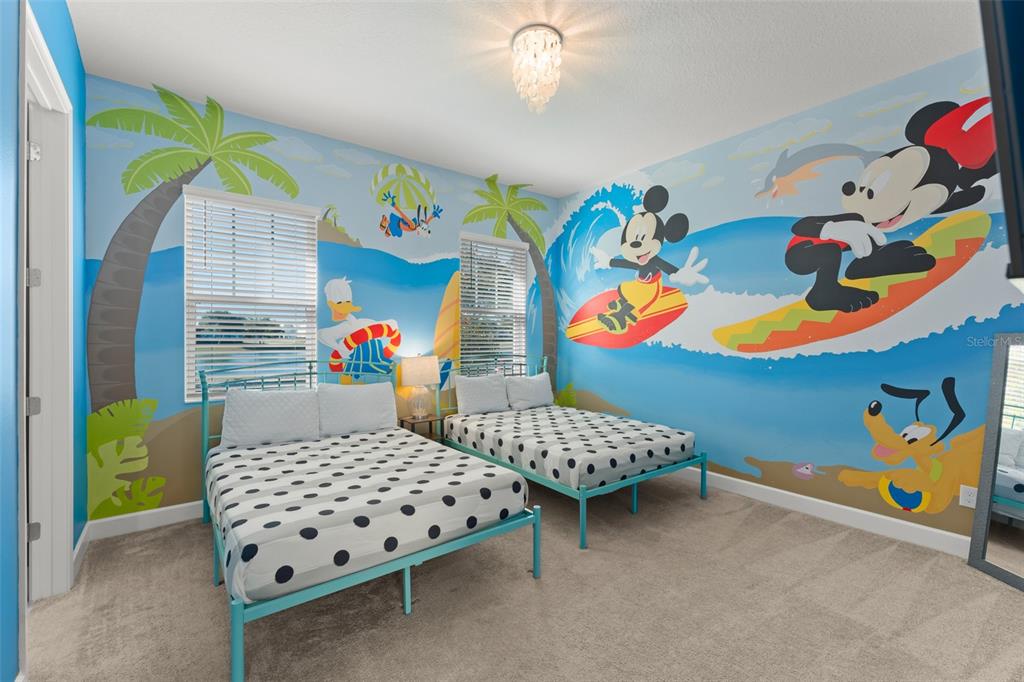 1531 Fairview Circle Reunion, FL 34747 - Photo 16 of 42 a bedroom with a bed and a couch