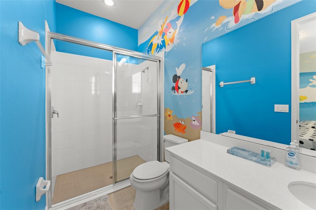 1531 Fairview Circle Reunion, FL 34747 - Photo 18 of 42 a bathroom with a sink toilet and shower