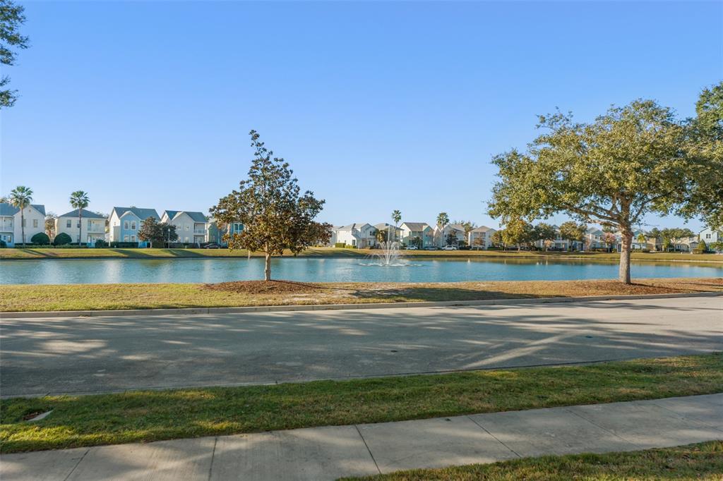 1531 Fairview Circle Reunion, FL 34747 - Photo 2 of 42 a view of a lake with houses in the back