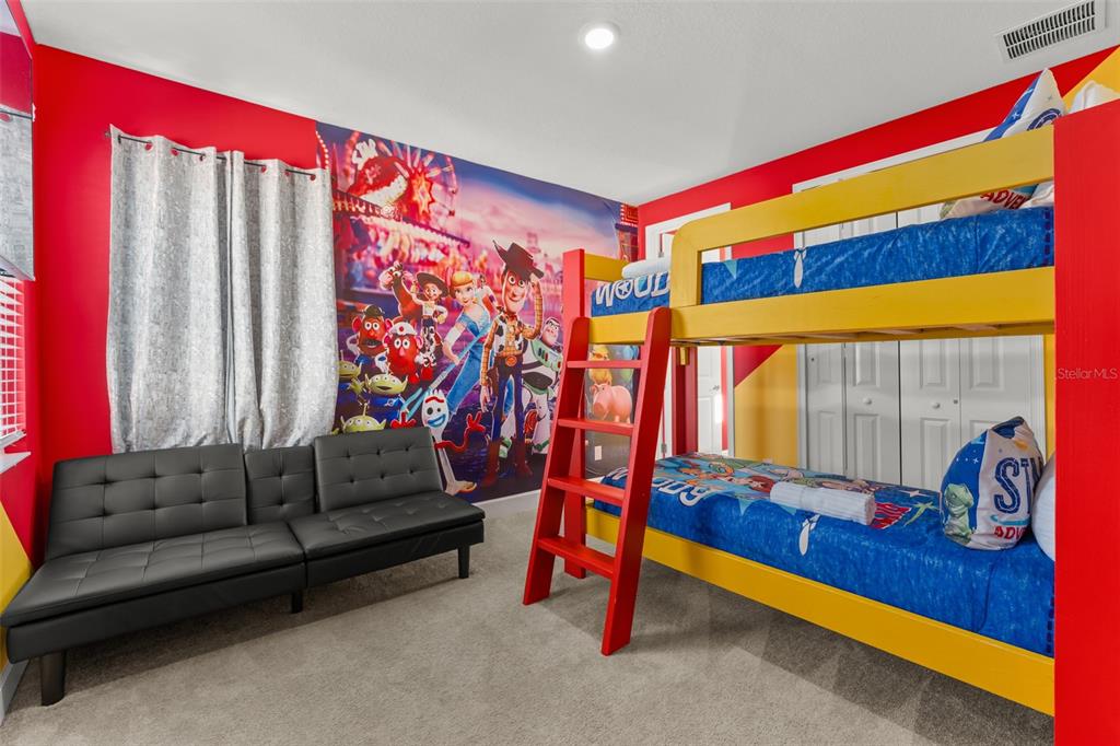 1531 Fairview Circle Reunion, FL 34747 - Photo 26 of 42 a living room with furniture and a flat screen tv