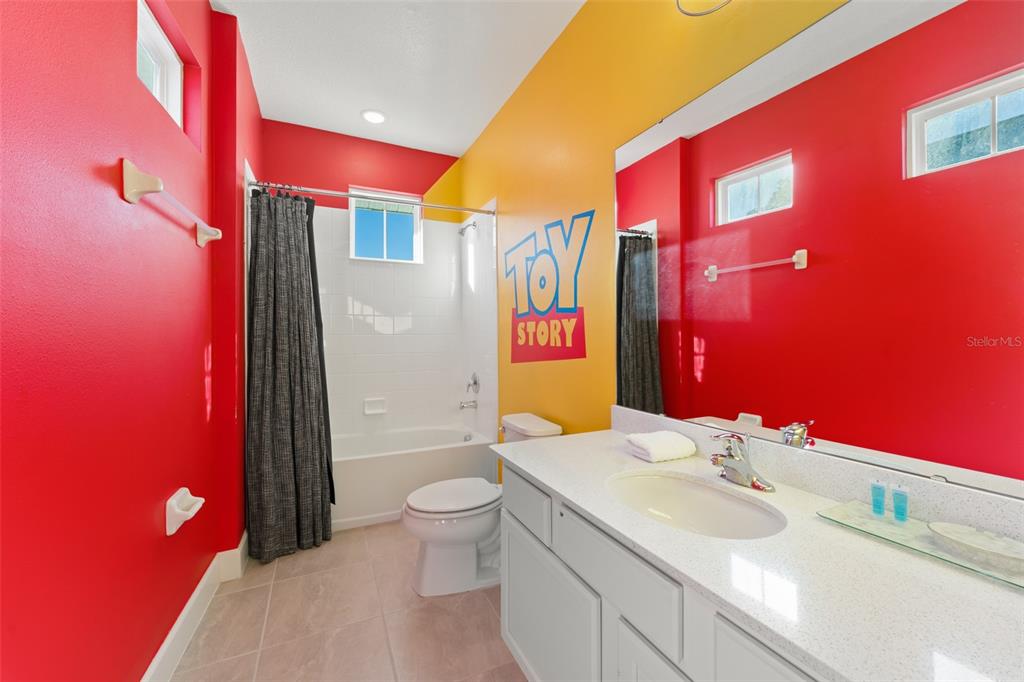 1531 Fairview Circle Reunion, FL 34747 - Photo 28 of 42 a bathroom with a sink and a mirror