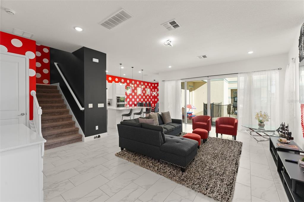 1531 Fairview Circle Reunion, FL 34747 - Photo 3 of 42 a living room with furniture and a flat screen tv