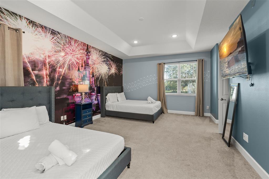 1531 Fairview Circle Reunion, FL 34747 - Photo 32 of 42 a living room with furniture and a flat screen tv