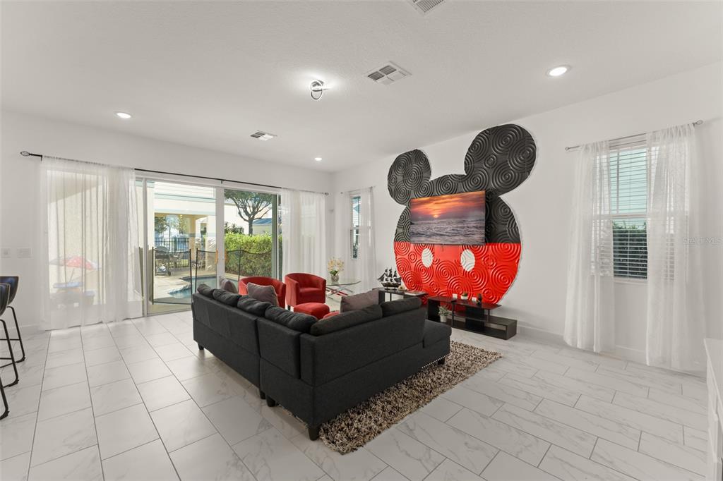 1531 Fairview Circle Reunion, FL 34747 - Photo 4 of 42 a living room with furniture and a large window