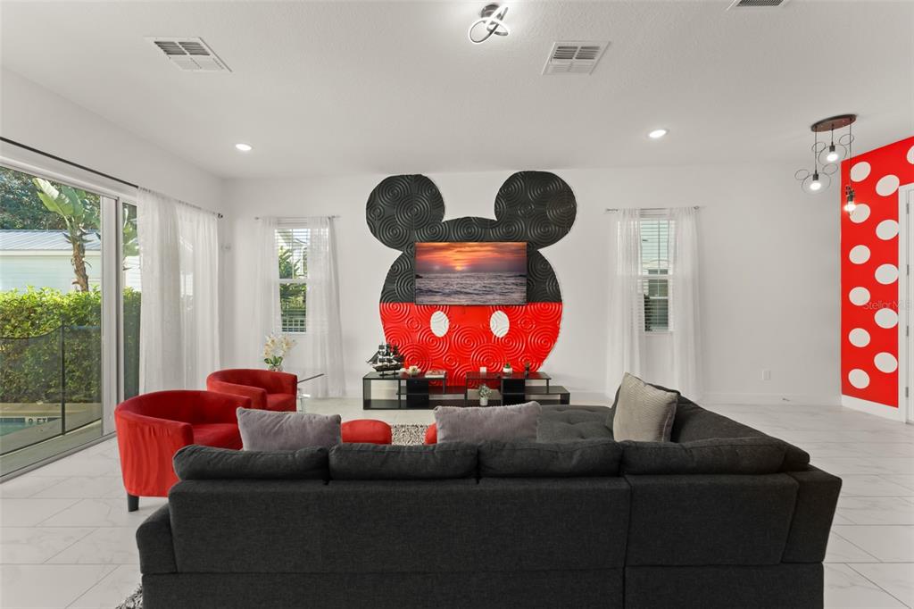 1531 Fairview Circle Reunion, FL 34747 - Photo 5 of 42 a living room with furniture and a window